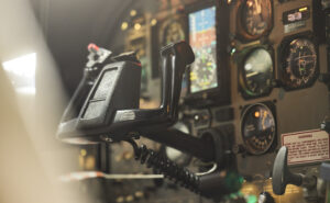 Inside a cockpit that is showing no pilot at the controls.