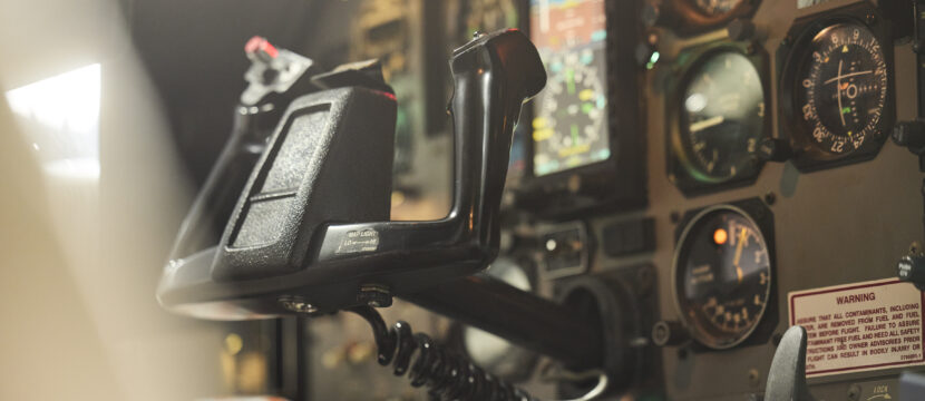 Inside a cockpit that is showing no pilot at the controls.