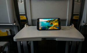 Tablet sits on a Vueling tray table, streaming content from the free wireless IFE. Vueling's Viasat-fitted aircraft can now offer this service.