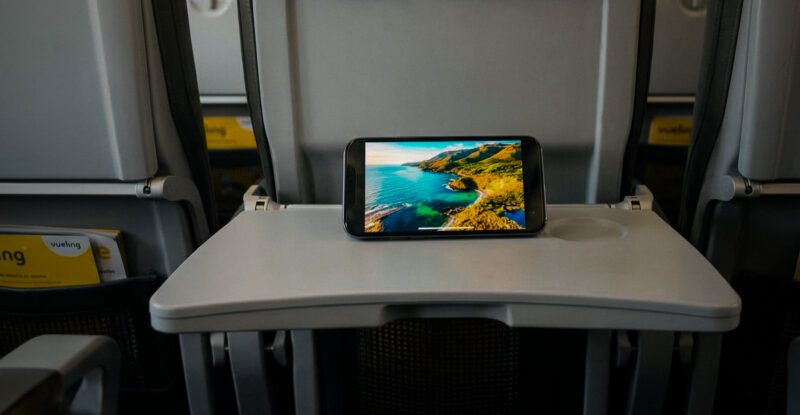 Tablet sits on a Vueling tray table, streaming content from the free wireless IFE. Vueling's Viasat-fitted aircraft can now offer this service.