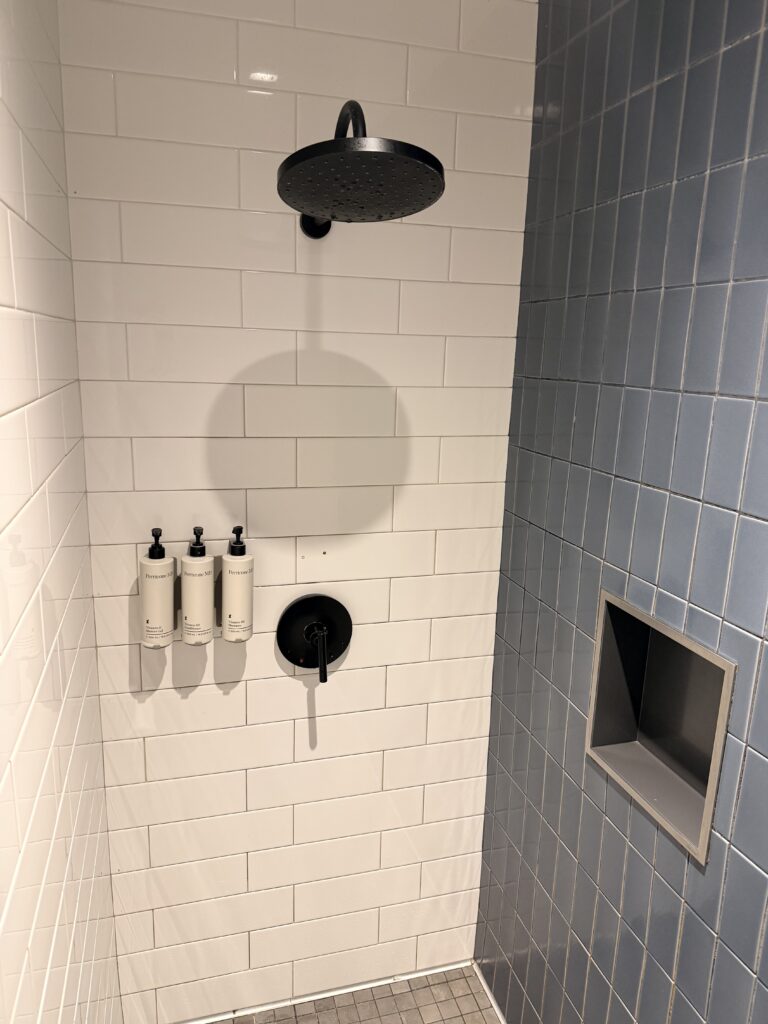 A large shower located in the United Club lounge.