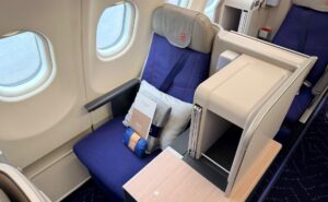 Brussels Airlines business class seat in blue with grey accents.