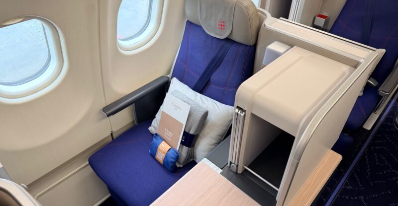 Brussels Airlines business class seat in blue with grey accents.