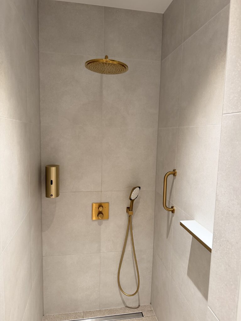 A large shower is ready for passenger use in The View Lounge.