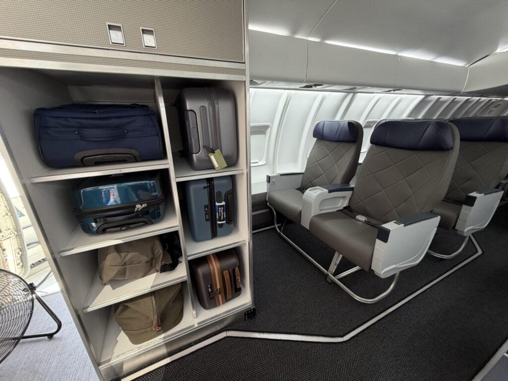 Luggage locker for first class passengers, which they can avail of before heading to their seats. 