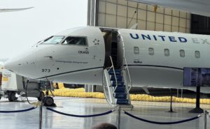 United Airlines CRJ-450 at an LAX hanger during a media event.