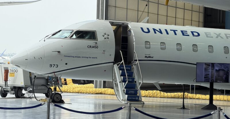 United Airlines CRJ-450 at an LAX hanger during a media event.