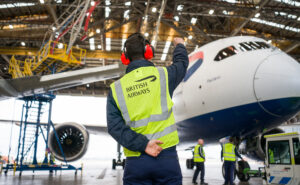 British Airways technician waves at the pilot of the Starlink-fitted 787