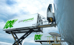 gategroup catering items are being loaded onto an aircraft.