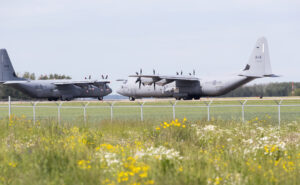 Two Royal Canadian Air Force Hercules C-130, with identifications 603 and 609, preparing for takeoff at Edmonton International Airport.