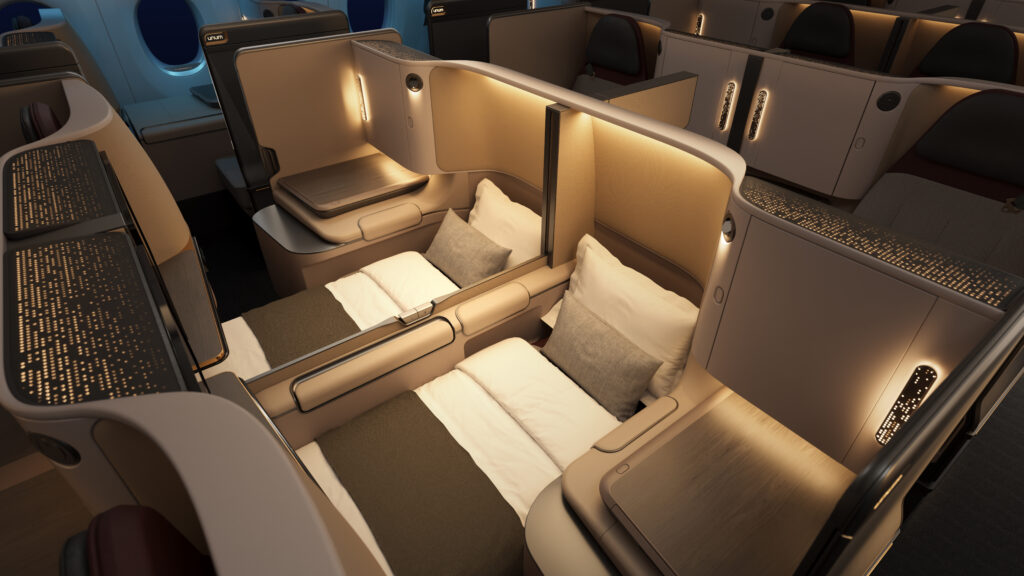 Unum Two business class center pair seats in bed mode.