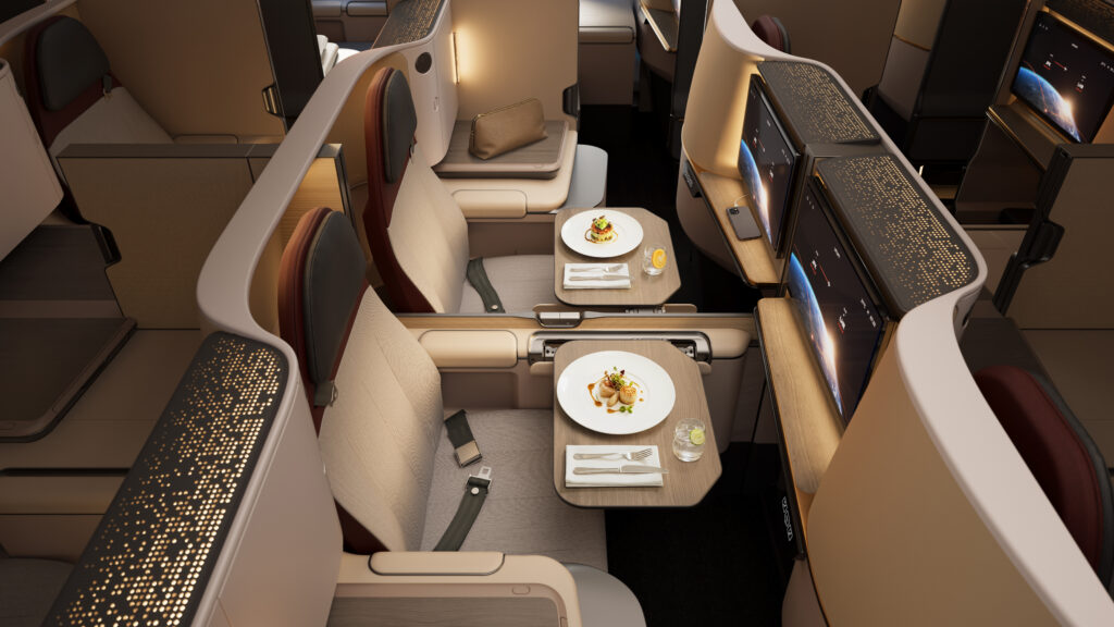Unum Two business class seats are set up for dining.