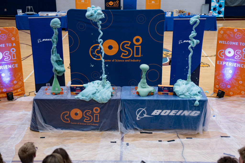 Boeing and COSI tables at a HIVE event