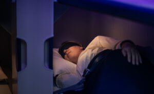 A passenger is sleeping in the Skynest.