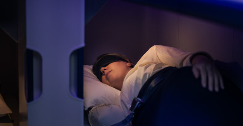 A passenger is sleeping in the Skynest.