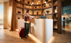 A passenger is checking into the Avianca Diamond International VIP lounge.