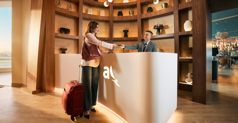 A passenger is checking into the Avianca Diamond International VIP lounge.
