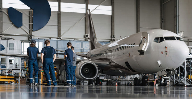 FL Technics Group's aviation maintenance hangar with an aircraft being tended to.