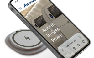A mobile device is charging using the EmPower Qi21 Wireless Charging Module.