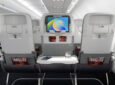 Seatbacks of Collins Helix seats. A device sits on a device holder in the middle seat. AIX 2026