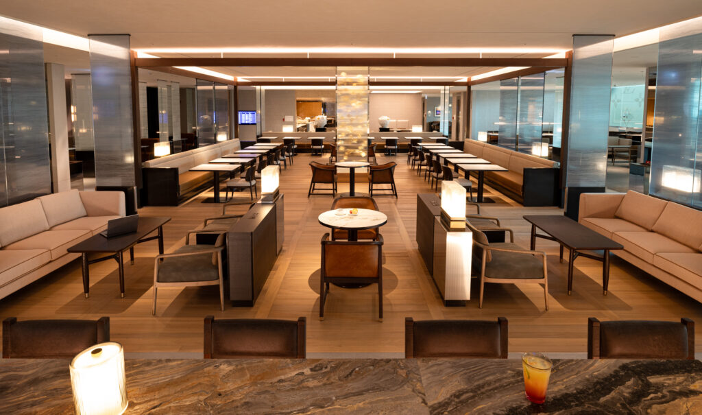 A large room with various seating and calming overhead and accent lights, as part of the Korean Air Incheon Prestige West Lounge