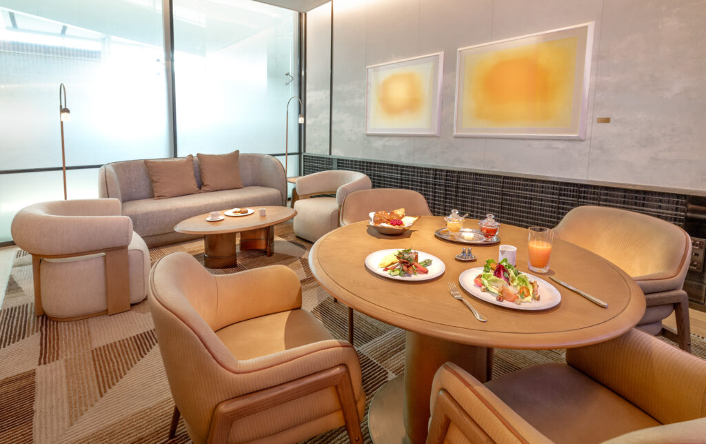 Plush sofas and chairs, plus a sturdy dining table, distinguish this space in the Korean Air Incheon First Class Lounge