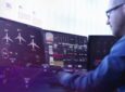 Man views aircraft ops data on multiple screens