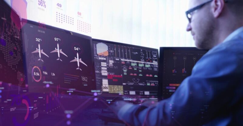 Man views aircraft ops data on multiple screens
