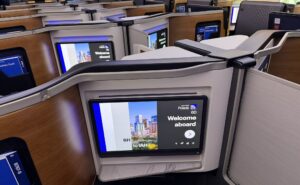Large IFE screen in United Polaris welcomes the passenger with an on-screen message