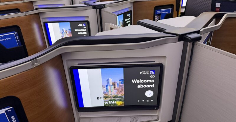 Large IFE screen in United Polaris welcomes the passenger with an on-screen message