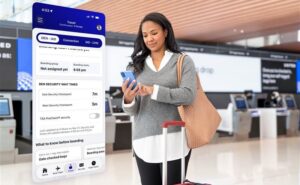 A United passenger is seen here using their mobile device for the new app. A picture of the new app interface is beside them.