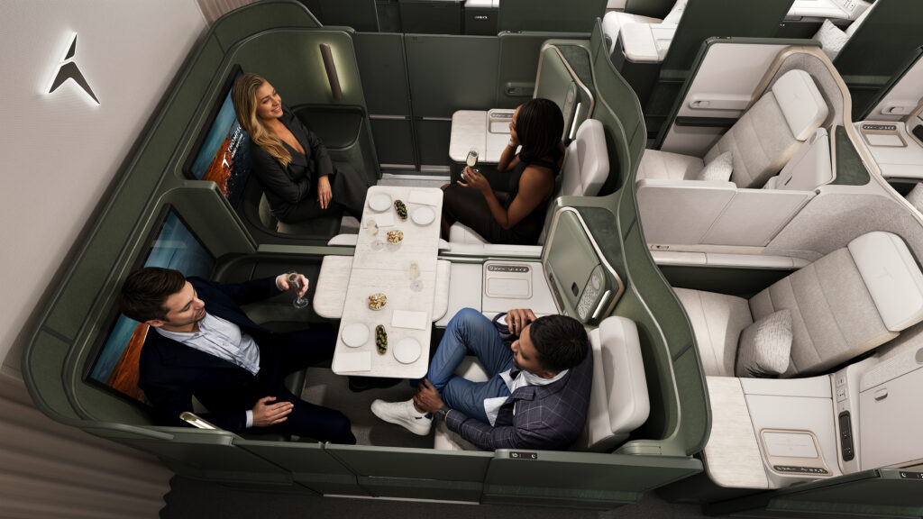 VantageXL+ seat by TAS. Four passengers are enjoying a meal together.