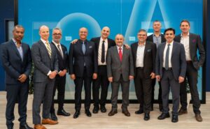 Executives from Viasat Aviation, Türksat and SkyFive Arabia stand for a photo together.