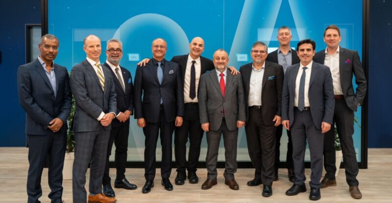 Executives from Viasat Aviation, Türksat and SkyFive Arabia stand for a photo together.