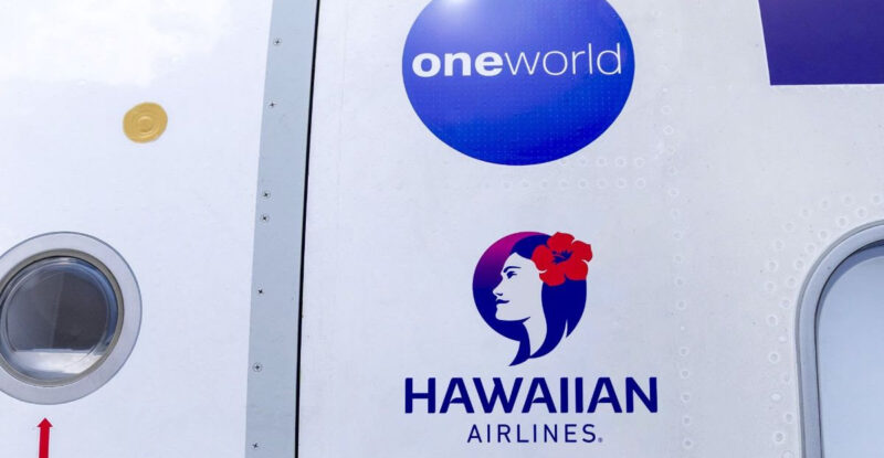 Alaska Airlines, Hawaiian Airlines and oneworld logos on the side of an aircraft