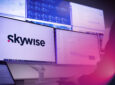 Skywise logo is seen on a large monitor.