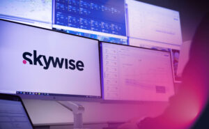 Skywise logo is seen on a large monitor.