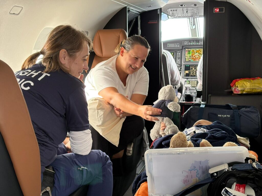 Medical team and a parent in the aircraft with the critical child.