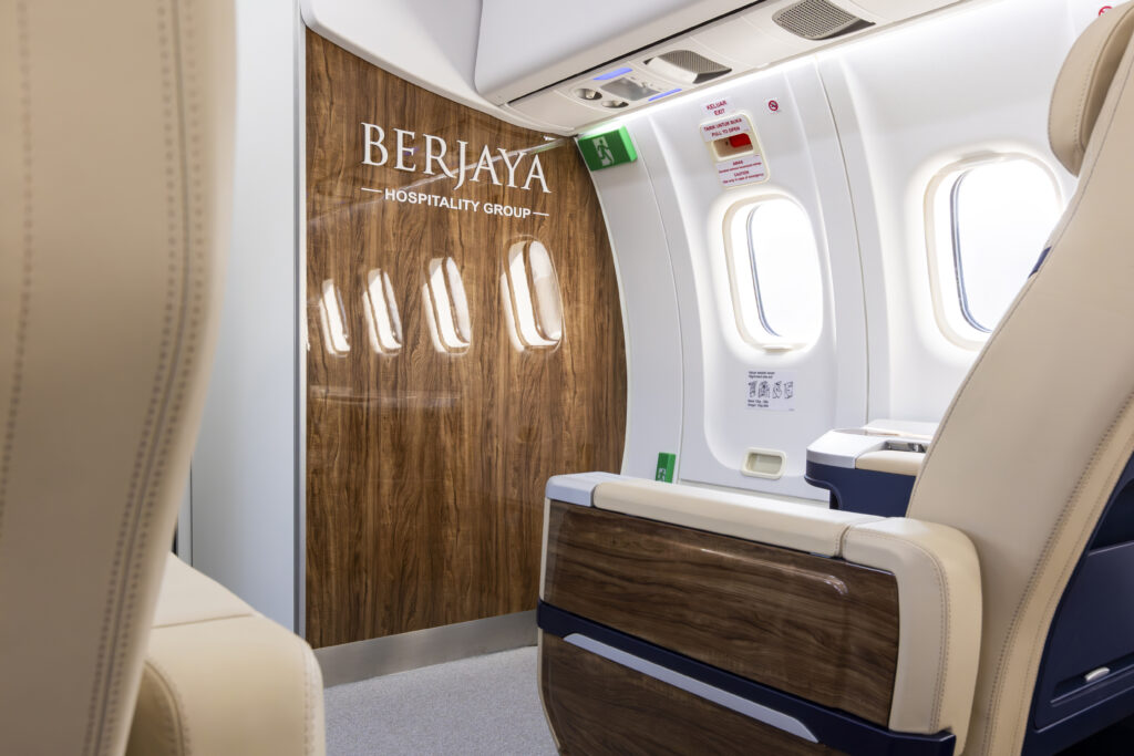 Berjaya Air's branding is seen on a wood panel on the bulkhead of the ATR.