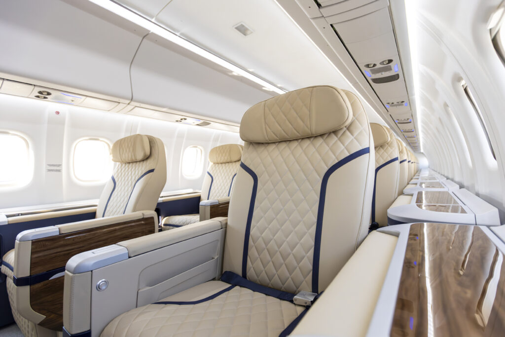ATR HighLine all-business cabin for Berjaya Air. Seat covers are diamond stitched and cream with blue piping; headrests are diamond stitched and beige