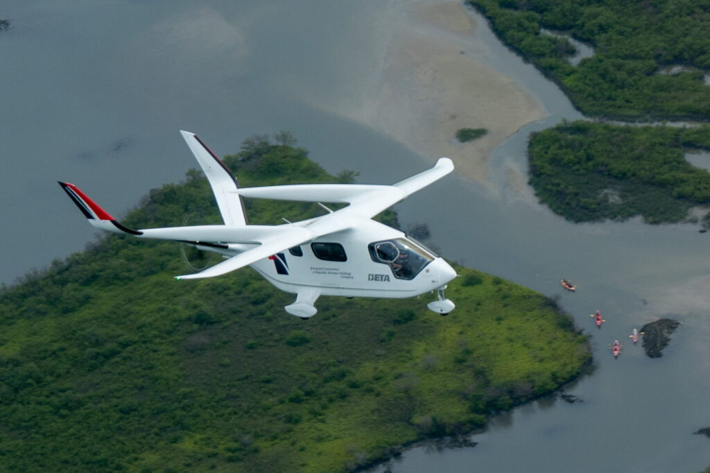 ALIA CTOL aircraft by BETA for Republic Airways is flying over land and water.