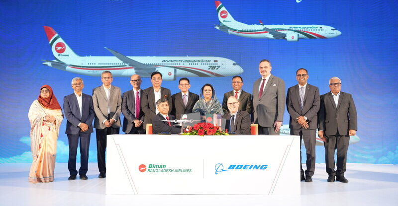 Boeing and Biman Bangladesh Airlines execs celebrate the deal
