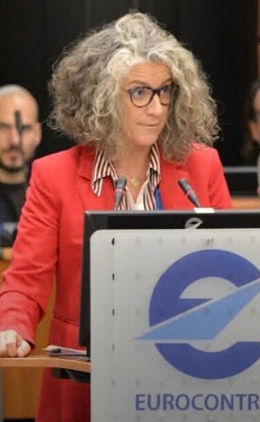 Dr. Tamara Pejovic speaking at an event.
