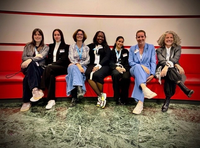 Dr. Tamara Pejovic and colleagues pose for a photo on a couch.