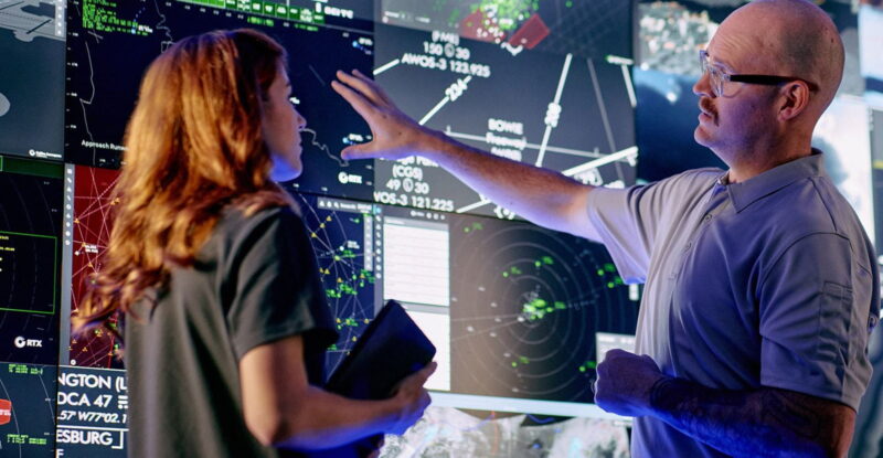 Controllers interact with advanced airspace surveillance and automation displays at a Collins Aerospace facility, supported by radar systems like those that will be produced at the company’s expanded Largo, Florida site, helping enhance situational awareness and decision-making in complex airspace environments.