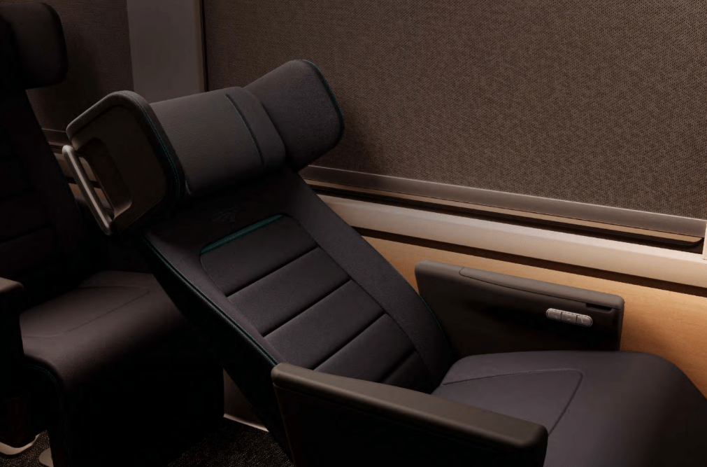 Amtrak Premium Coach class seat in recline.