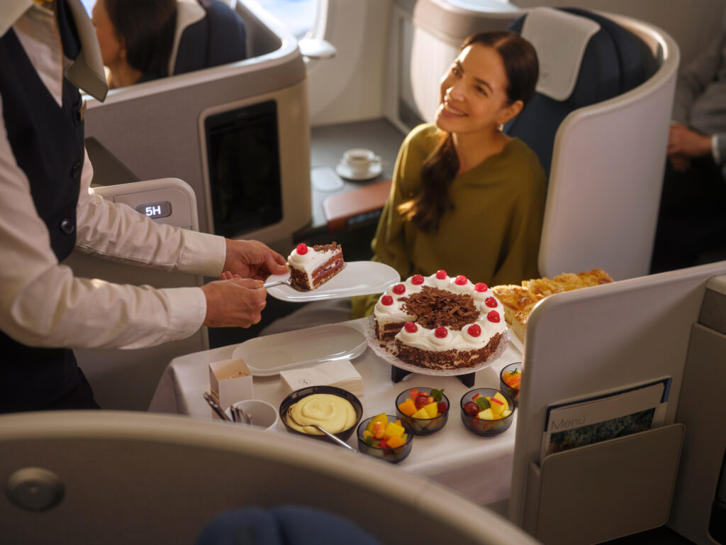 A variety of deserts are displayed for the passenger to choose from. 