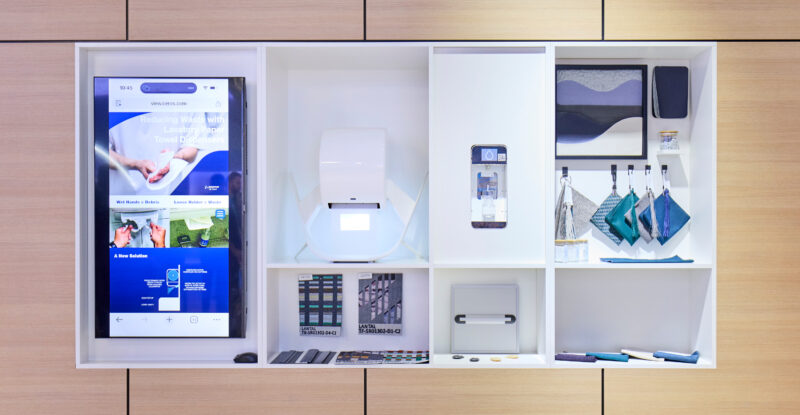 Boeing's sustainability wall at AIX 2026, featuring a variety of different products that are either part of its catalog or in the process of becoming linefit offerable.