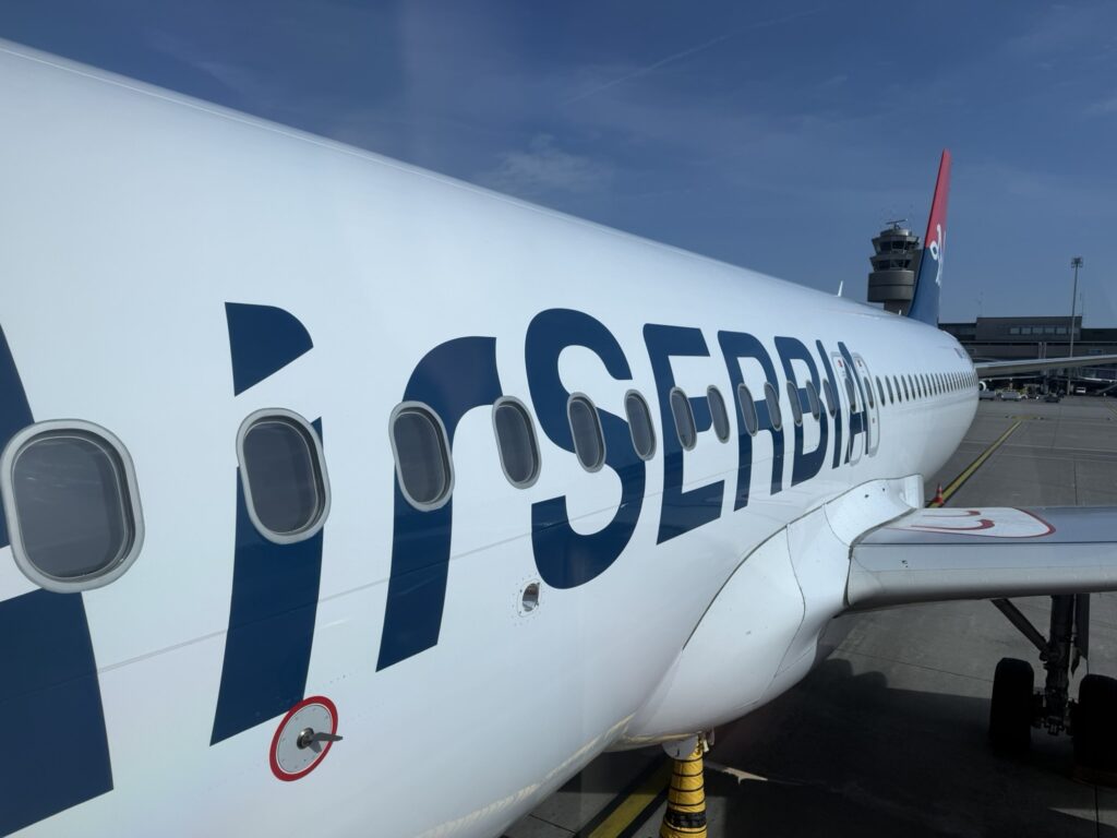 Air Serbia A320 at the gate for boarding.