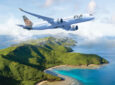 Fiji Airways aircraft in flight over an island.